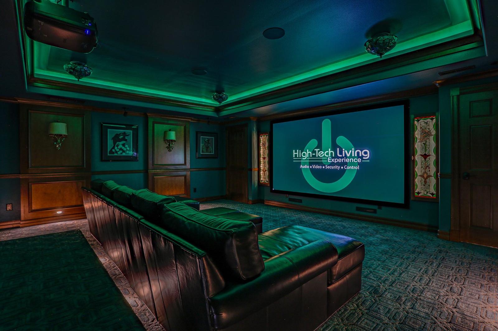 Marysville home theater with the High-Tech Living Experience logo on the screen