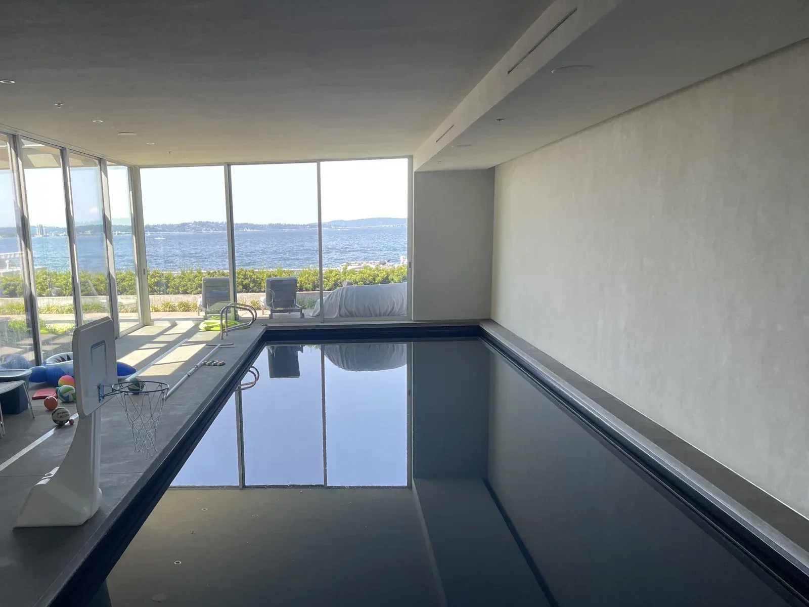 Indoor pool with a wall of windows facing the lake, Mercer Island