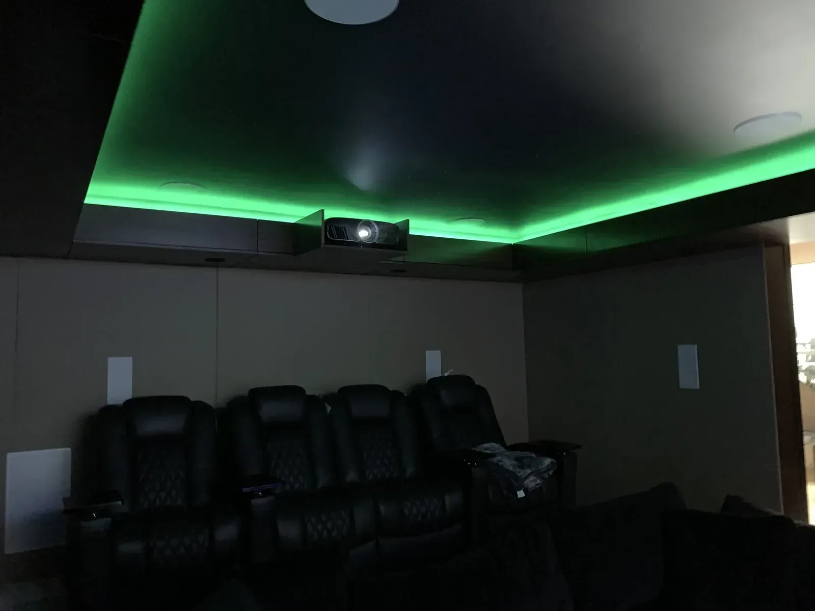 Home theater with green cove lighting and recliners, Redmond