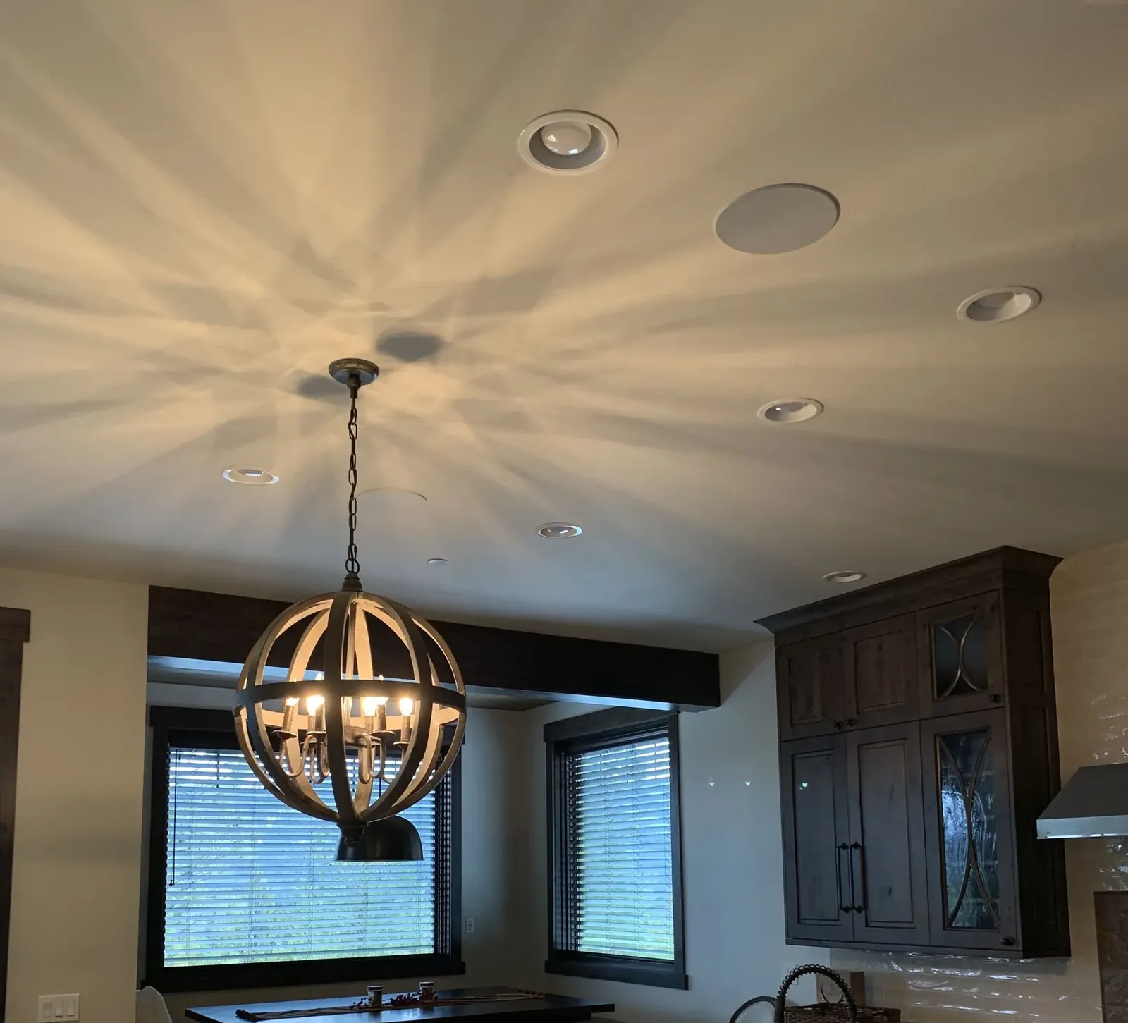 Kitchen ceiling with a flush in-ceiling speaker among recessed lights