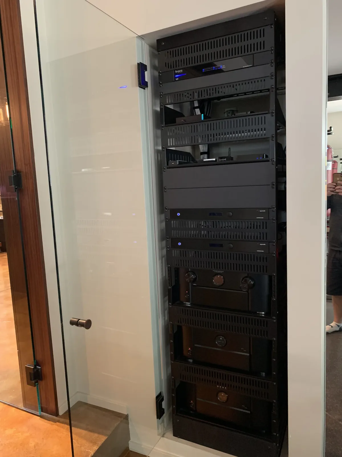 Equipment rack behind a glass door